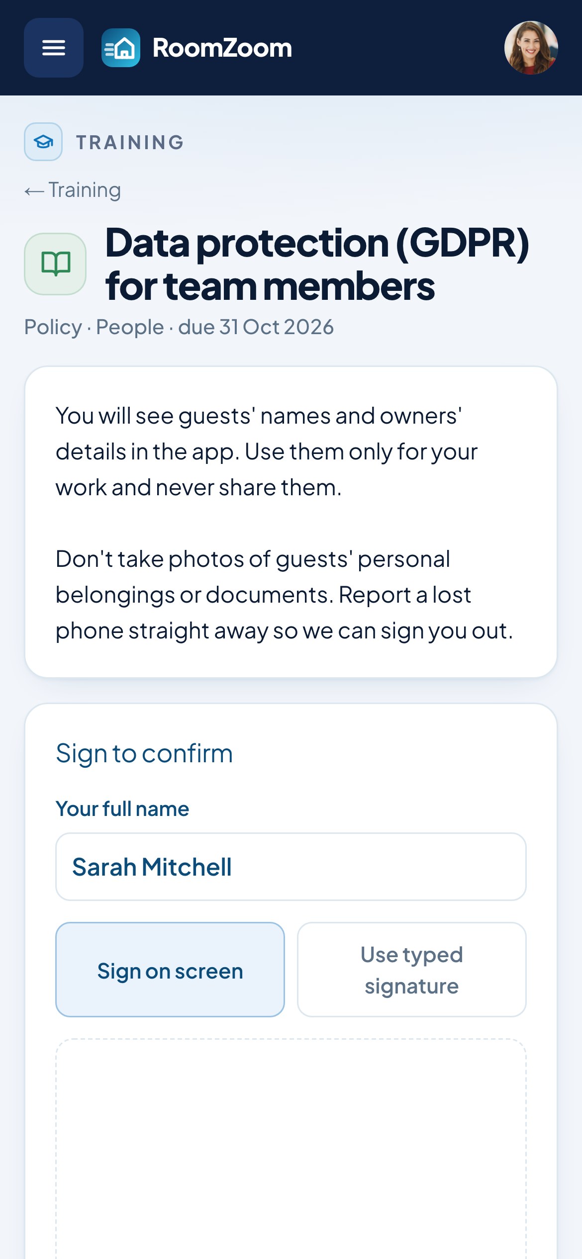 A cleaner reading a data protection policy on a phone and signing to confirm